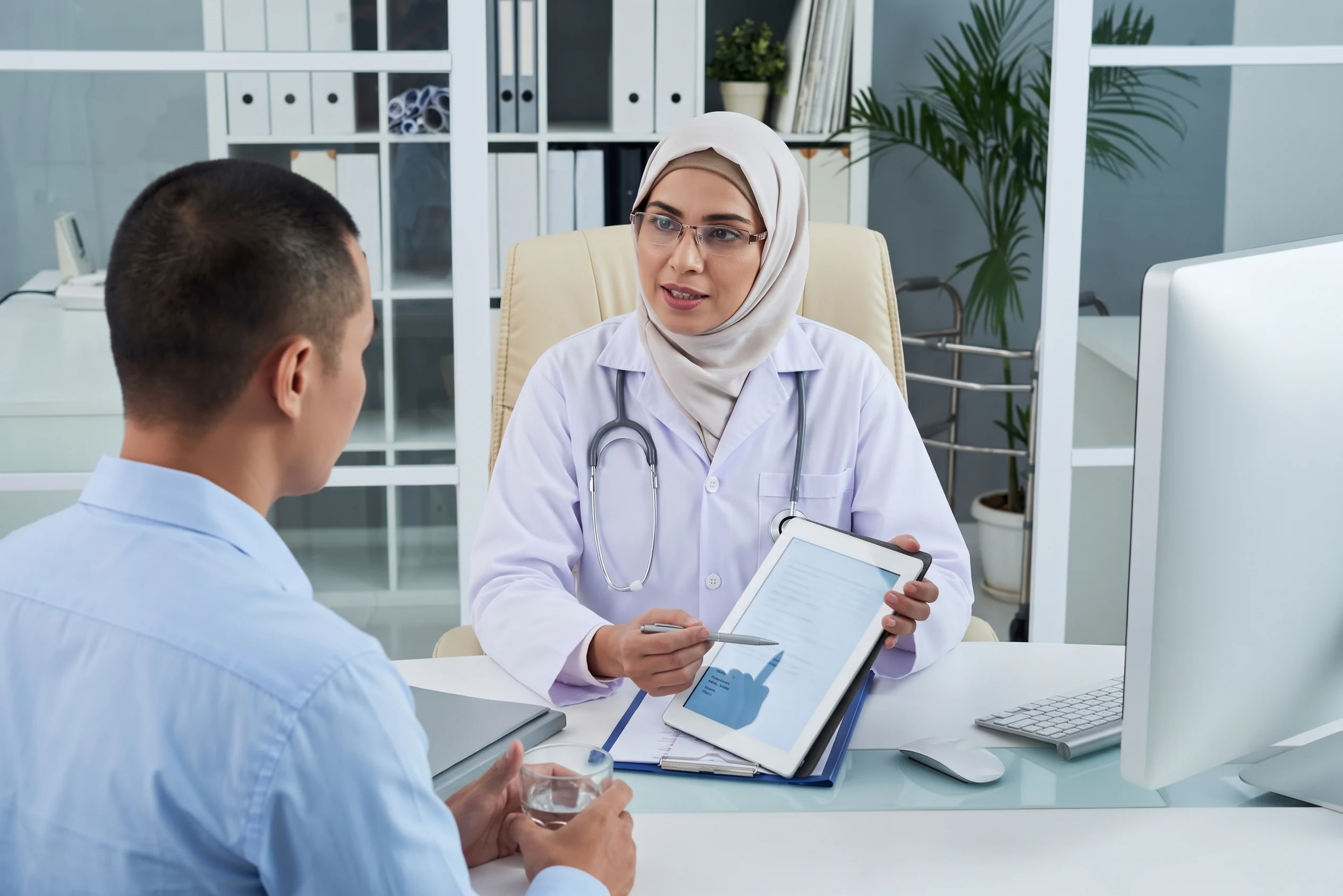 Doctor discussing medical screening results with a patient