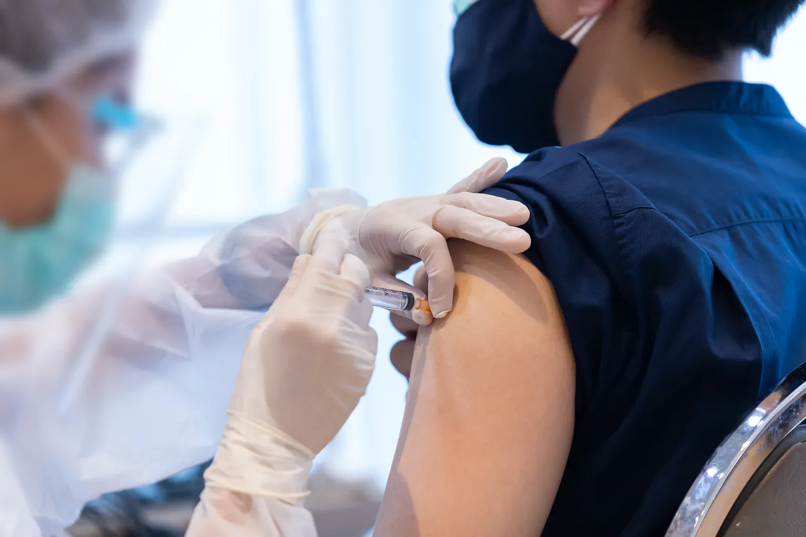 Healthcare professional administering a vaccination