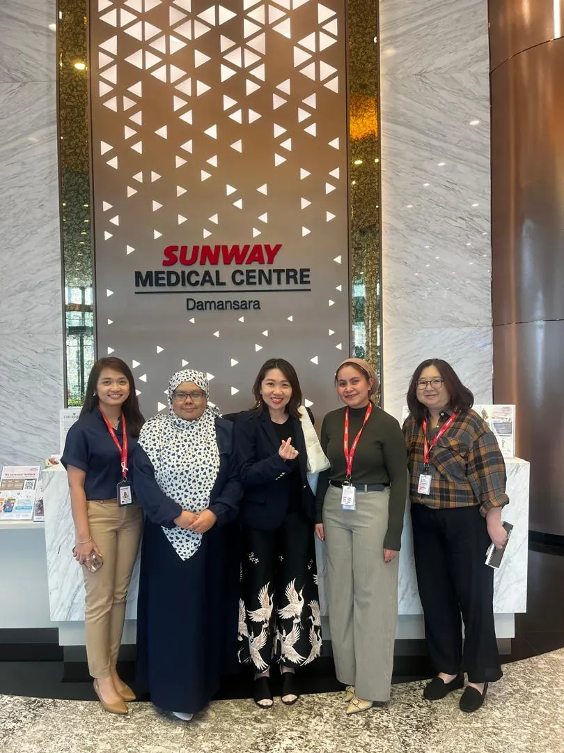 Group photo from the event with Blooms Healthcare