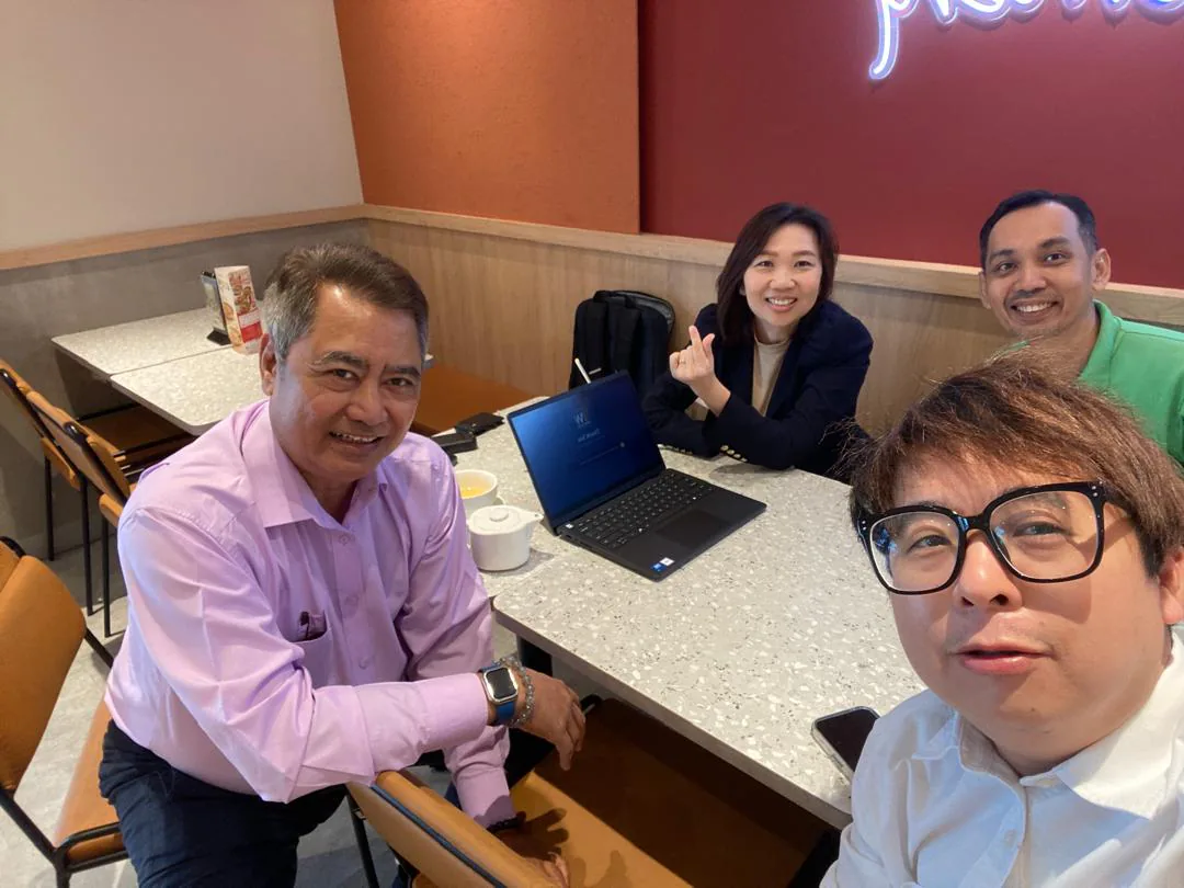 Regency JB and OneWorks representatives discussing collaboration opportunities